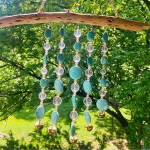 Beaded turquoise wind chimes on driftwood